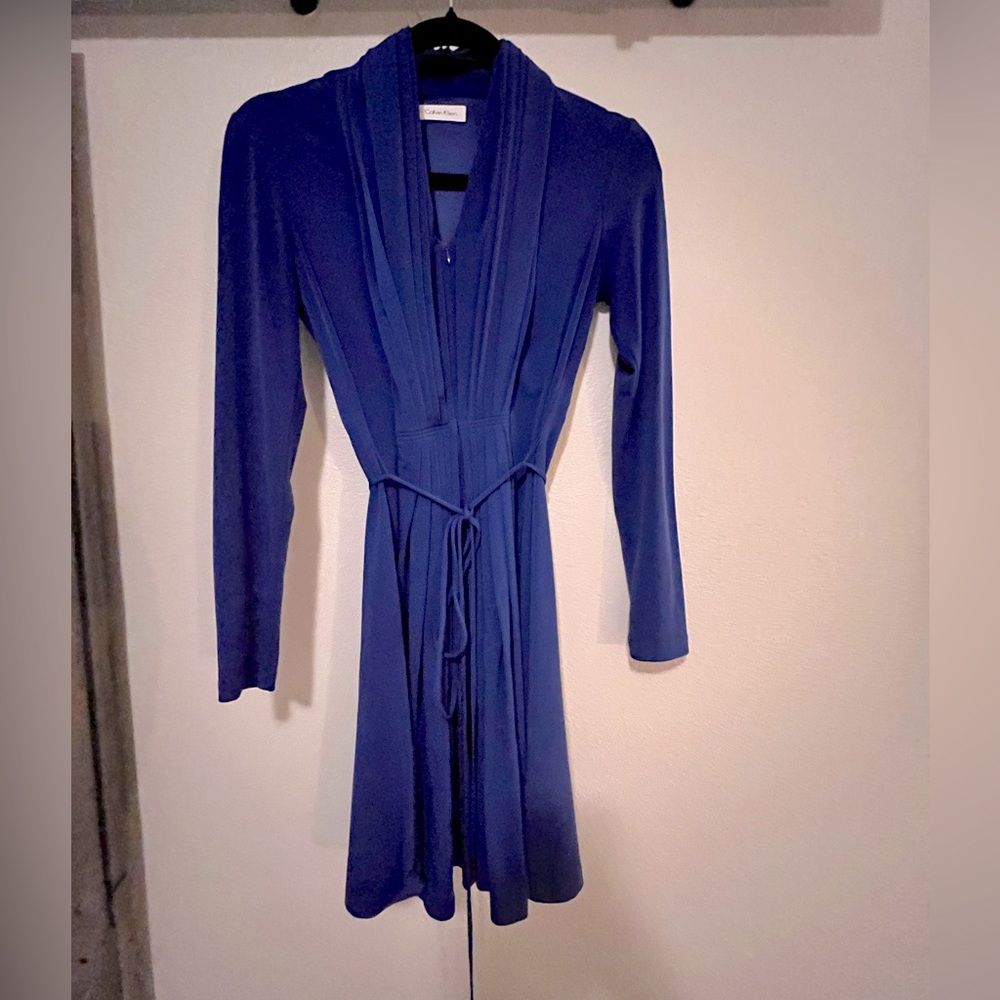 Beautiful blue long-sleeve Calvin Klein dress. Size 2. Zipper in front.